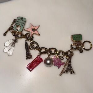 Juicy Couture Gold Tone Charm Bracelet with Travel Charms